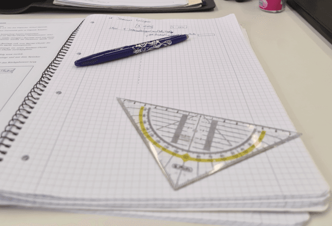 Handwritten notes and basic tools used for structured learning and problem-solving