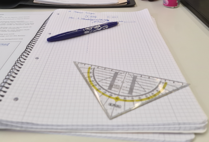 Handwritten notes and basic tools used for structured learning and problem-solving